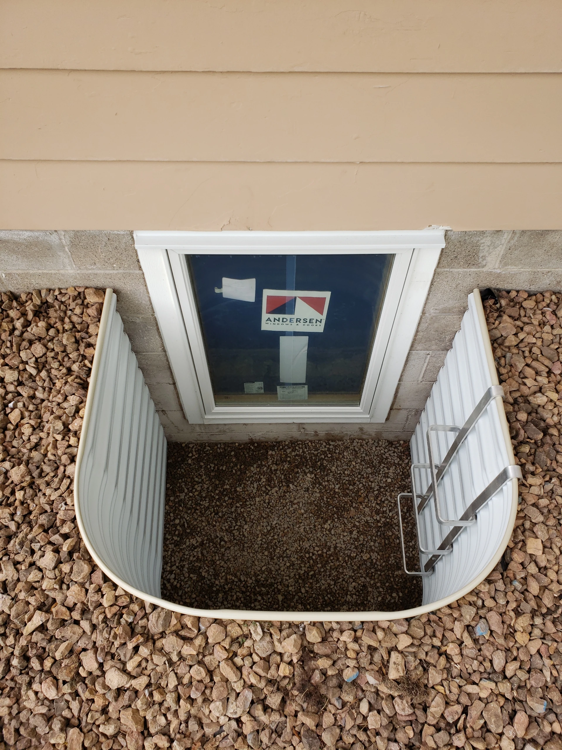 Standard Andersen clad casement egress window with corrugated metal well and gravel — Twin Cities Metro MN