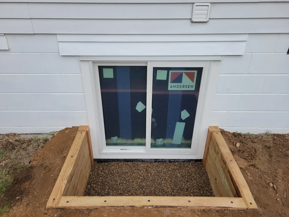 Double timber egress well installed