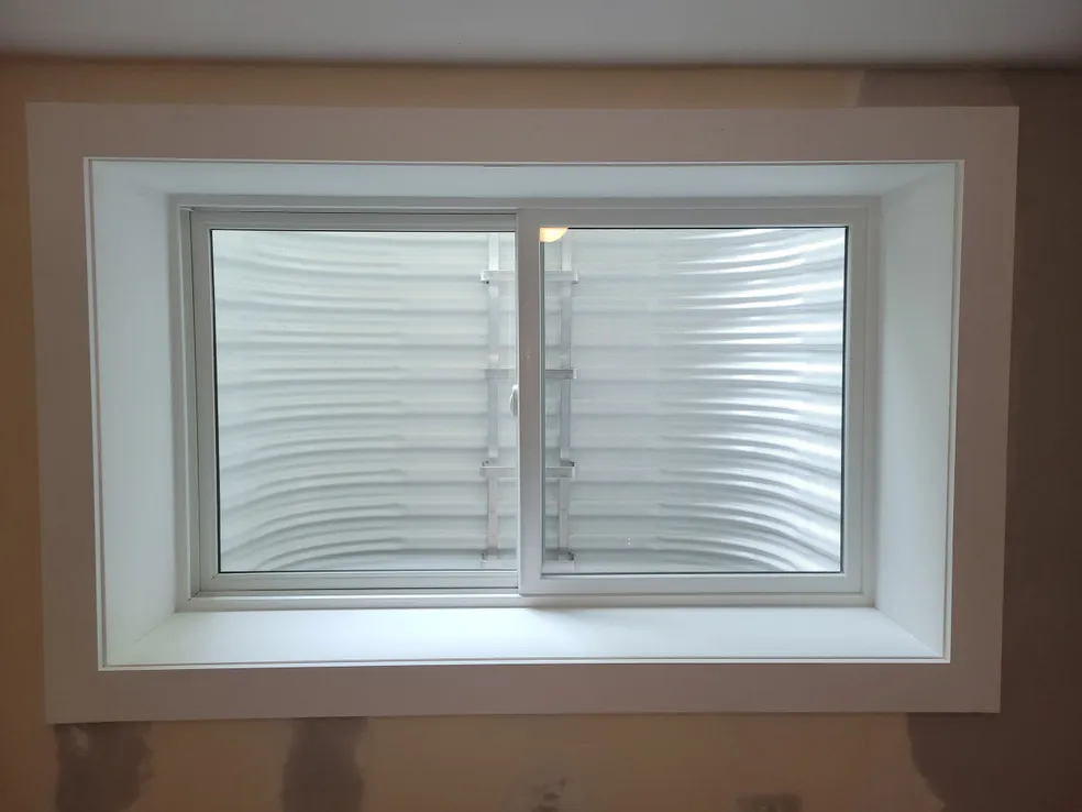 White trim double egress window interior finish